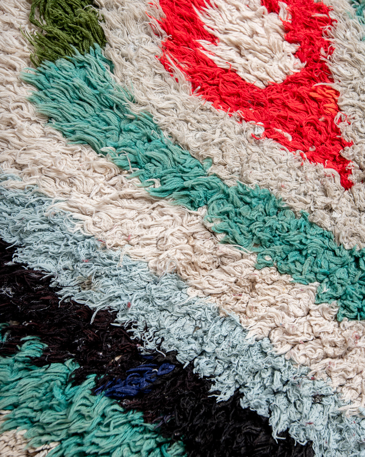 Modern designer vintage handcrafted Berber rug from Morocco. Boucherouite runner rug with beautiful colors and patterns.